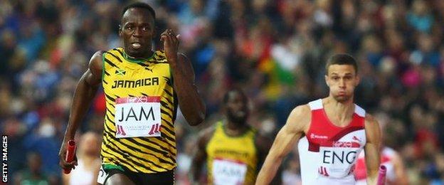 Usain Bolt of Jamaica holds off England's Danny Talbot