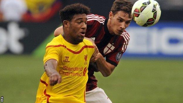 Liverpools Jordon Ibe challenges AC Milan"s Mattia de Sciglio