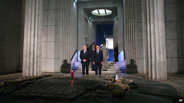 President Francois Hollande stands next to German President Joachim Gauck in the crypt of the the National Monument of Hartmannswillerkop, in Wattwiller, eastern France