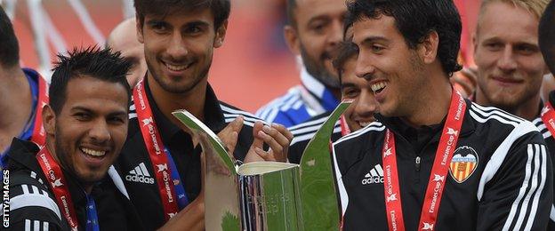 Valencia players celebrate after winning the Emirates Cup