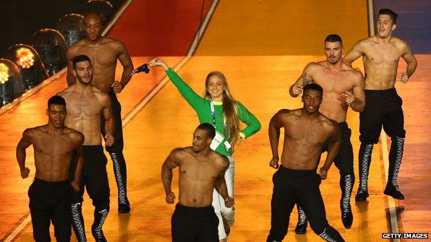 Genevieve LaCaze on stage with Kylie Minogue's dancers