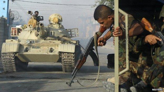 Kurdish Peshmerga forces battle IS militants in Jalawla, Diyala province. 12 July 2014