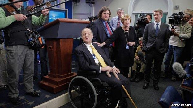 Former White House Press Secretary James Brady visit the press briefing room that bears his name in the West Wing of the White House with current Press Secretary Jay Carney (3rd R) 30 March 2011 in Washington, DC.