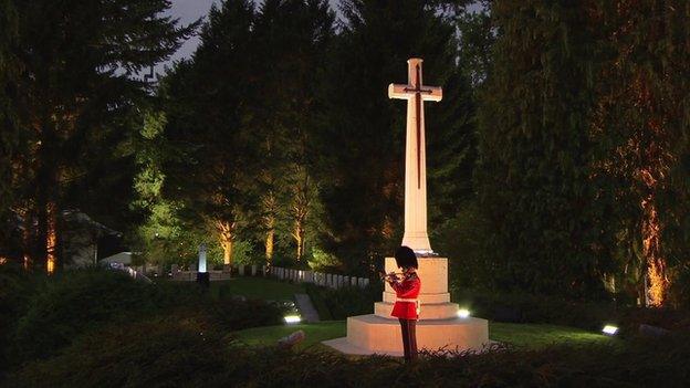 Last Post being played at St Symphorien Military Cemetery