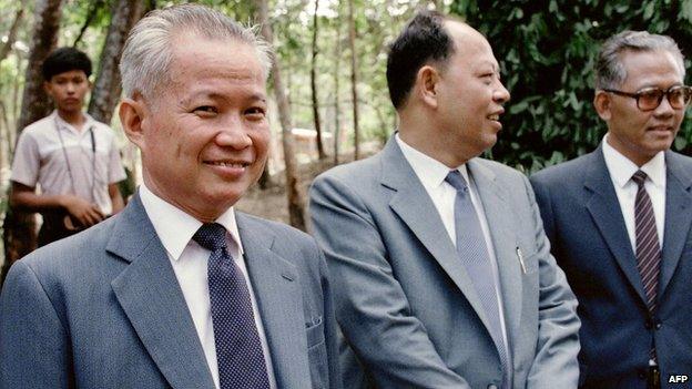 Khieu Samphan, then-Vice-President of The Coalition Government of Democratic Kampuchea (CGDK), smiles in the Khmer Rouge stronghold of Dong Rek during a meeting with Chinese diplomats on 22 August, 1985