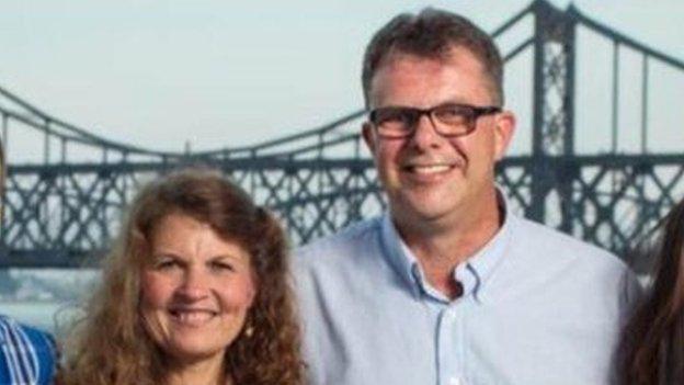 Photo of the Garratt family in front of the bridge linking China and North Korea