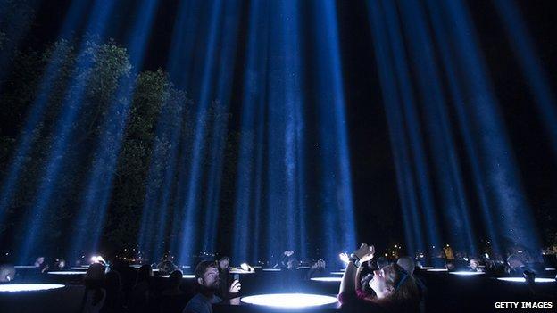 Visitors look at Spectra in London