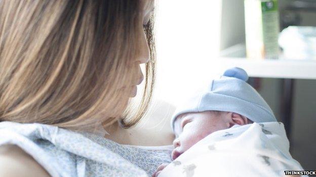 Woman holding baby