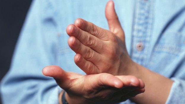 Person doing sign language, close up on hands