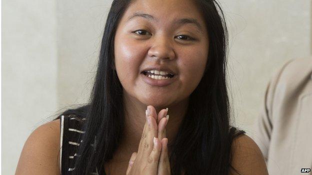 Thai surrogate mother Pattaramon Chanbua gives a traditional greeting to the media during a press conference at the Samitivej hospital in Sriracha district, Chonburi province on 5 August 2014