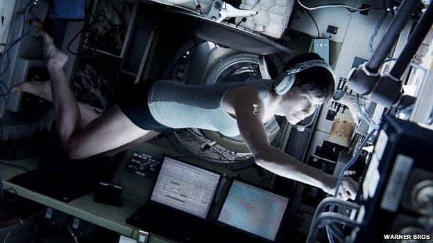 Pictures shows Sandra Bullock in a scene from "Gravity."