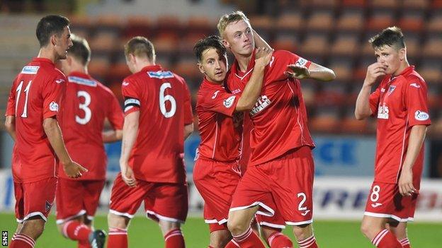 Ross Millen is congratulated on his winning goal