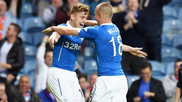 Kenny Miller congratulates the scorer of Rangers' first goal, Lewis Macleod