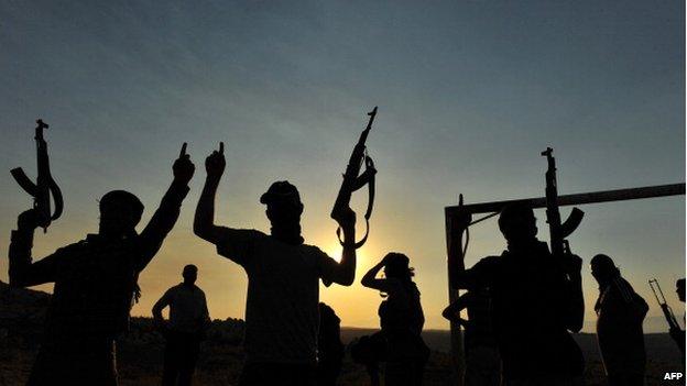 Members of Jihadist group Hamza Abdualmuttalib train near Aleppo on 19 July 2012.