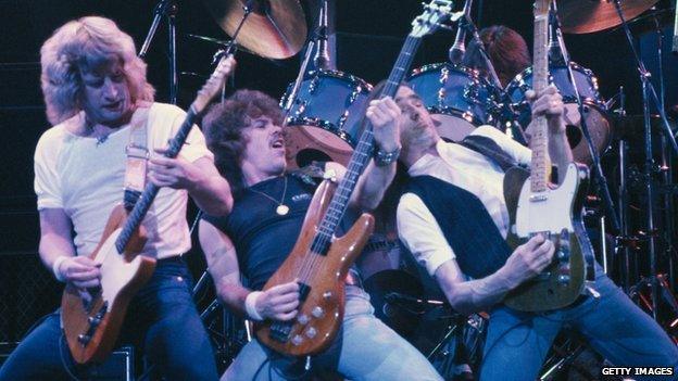 Rick Parfitt (left) and Status Quo in 1984