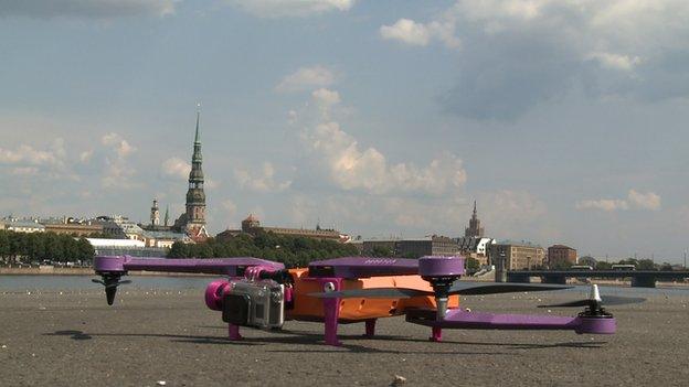 Air Dog drone on the ground with Riga in the background