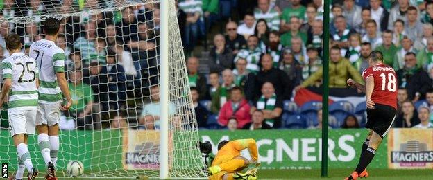 Michal Kucharczyk (right) beats Fraser Forster (centre) to put Legia Warsaw 2-0 ahead