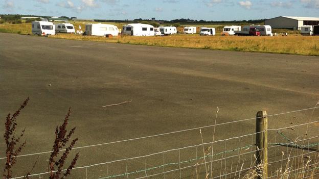 Travellers on the airfield site