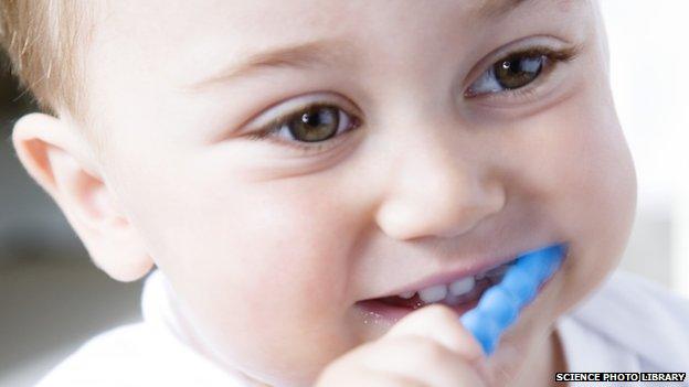 A young boy brushing his teeth