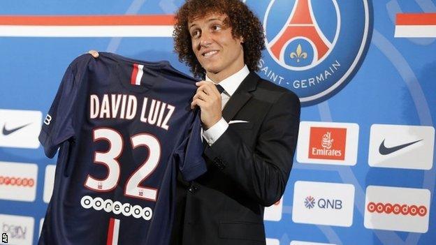 David Luiz holds up PSG jersey