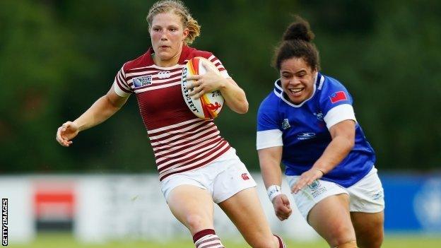 England's Lydia Thompson (l) in action against Samoa