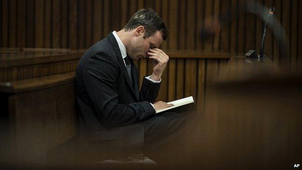 Oscar Pistorius reacts as he listens to the state prosecutor closing argument at his murder trial in Pretoria, South Africa - 7 August 2014