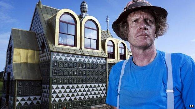 Grayson Perry in front of the chapel in Wrabness