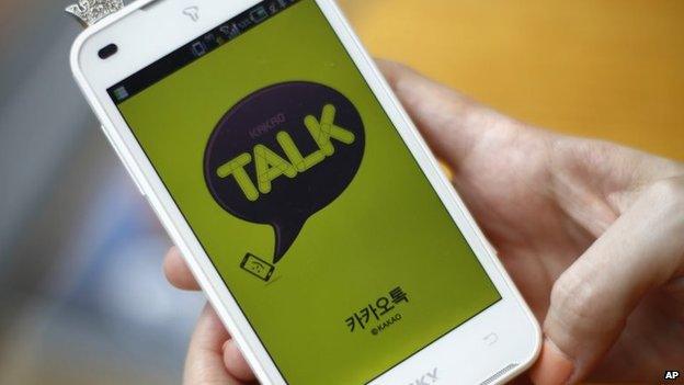 File photo: A woman opens KakaoTalk, a South Korean mobile messaging app, 20 August 2012