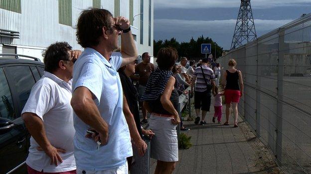 Locals looking at Russian ship