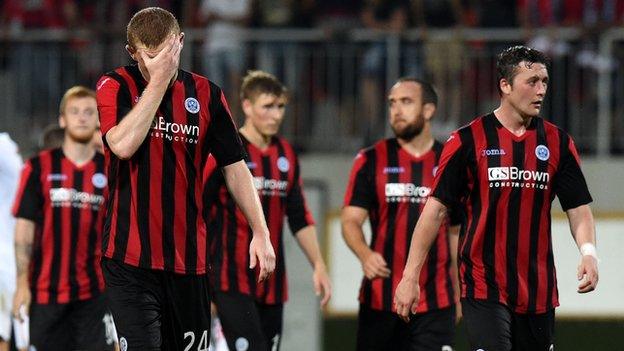 The St Johnstone players trudge off after exiting the Europa League