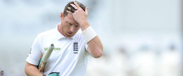 England's Ian Bell walks off