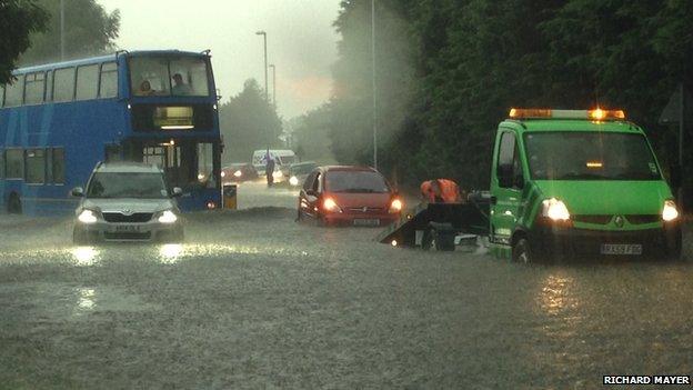 Cars trapped in flooding near the Bar Hill roundabout