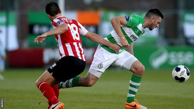 Shamrock Rovers's Ryan Brennan bursts past Philip Lowry at Tallaght Stadium