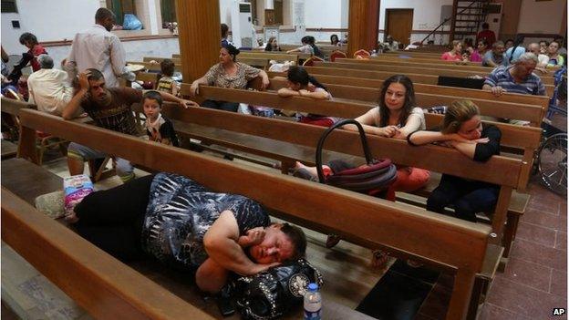 Displaced Iraqi Christians settle at St. Joseph Church in Irbil, 07/08/2014