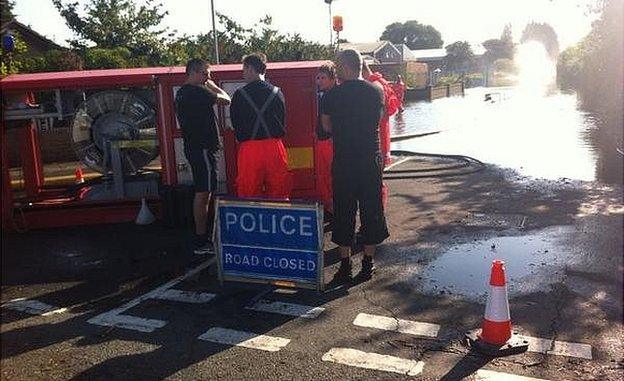 Fire crews in March helping to pump out flood water