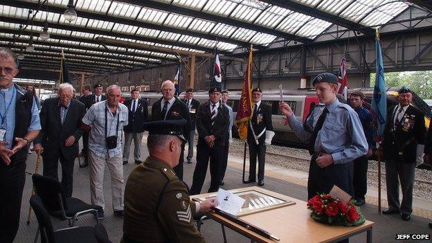 A re-enactment of a soldier receiving the King's Shilling