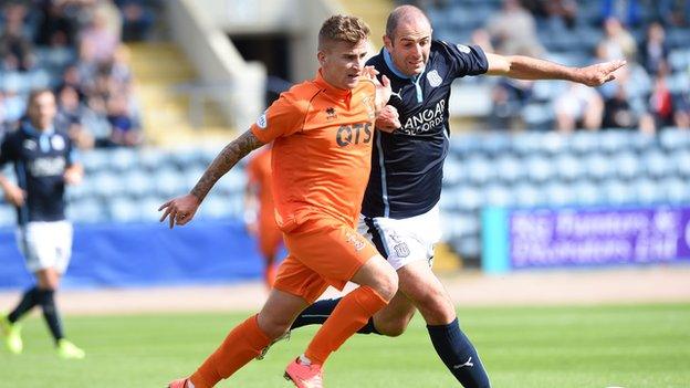 Goalscorers Gary Harkins and Craig Slater tussle for the ball at Dens Park