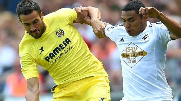 Mario Gaspar of Villarreal (left) and Jefferson Montero of Swansea City