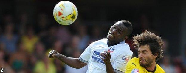 Watford's Gianni Munari and Bolton Wanderers' Medo contest a header