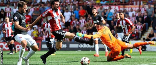 Brentford's Jonathan Douglas goes close.