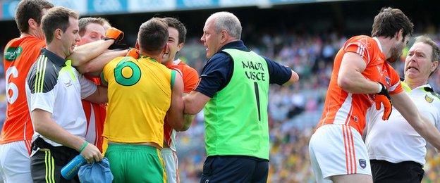 A scuffle breaks out between Armagh and Donegal players and officials during the All-Ireland quarter-final