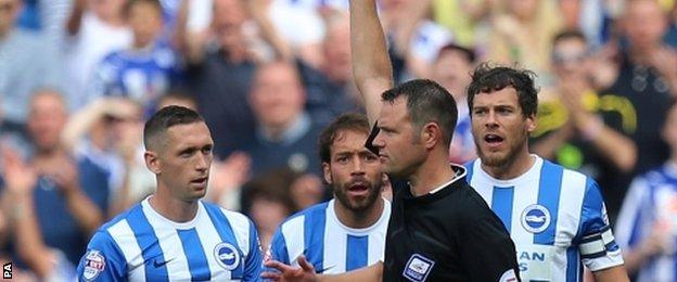 Referee James Linington sends off Brighton"s Andrew Crofts