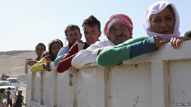 Displaced people from Yazidi sect re-enter Iraq from Syria at Iraqi-Syrian border crossing in Fishkhabour, Dohuk Province. 10 Aug 2014