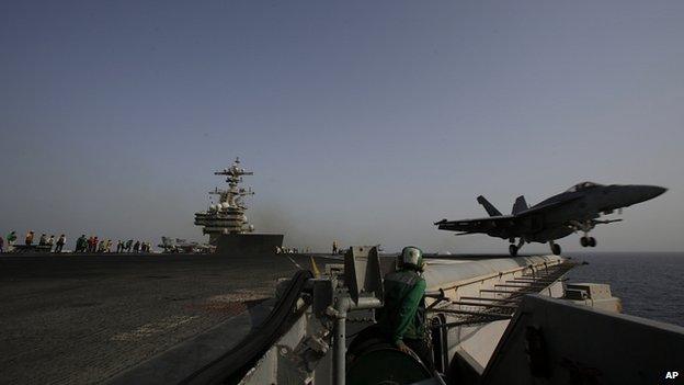 F/A-18C Hornet takes off for Iraq from flight deck of aircraft carrier USS George HW Bush in the Gulf. 10 Aug 2014