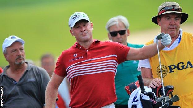 Jamie Donaldson of Wales prepares to hit an approach shot