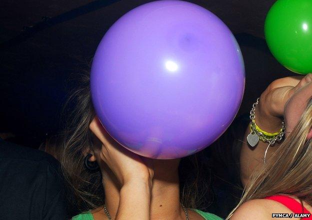 A women with a laughing gas balloon