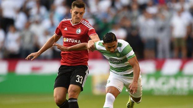 Emilio Izaguirre (right) is closed down by Legia Warsaw's Michal Zyro