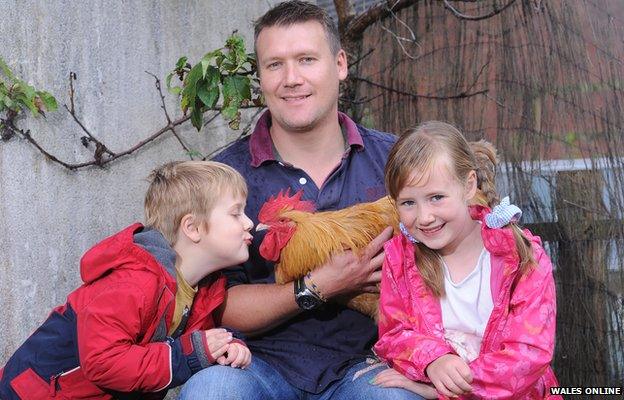 Geraint Rees with son Taran, daughter Seren, and Bomper the cockerel