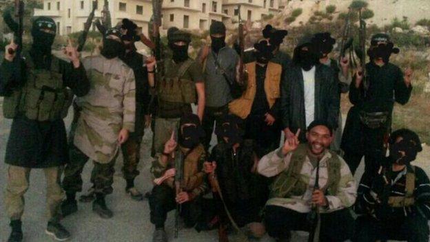 Prosecutors say this picture show Aine Davis with fighters in Syria