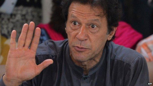 Cricketer-turned politician and chairman of Pakistan Tehreek-e-Insaf (PTI) or Movement for Justice party, Imran Khan speaks during a press conference at his residence in Islamabad (8 August 2014)